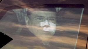Berlusconi quits hospital, calls for calm
