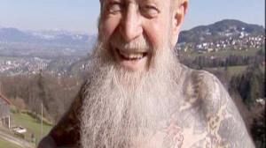 World’s oldest tattooist exhibits photos