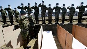 Temporary mass graves for Japan tsunami victims