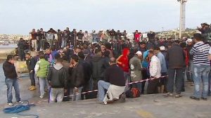 First migrant boat from Libya lands on Italian island