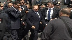 Berlusconi complains court case obstructs his duties