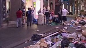 People in Naples block streets with binbags