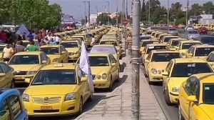 Striking taxi drivers block roads in Athens