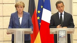 Sarkozy, Merkel urge closer euro economic governance