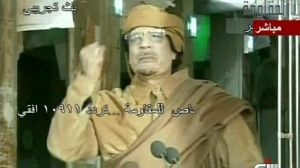 Gaddafi vows never to surrender