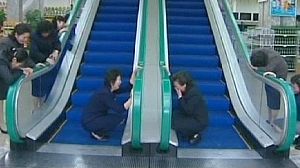 Dévotion sur escalator en Corée du Nord