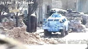 Syrian troops pound Homs with mortar strikes