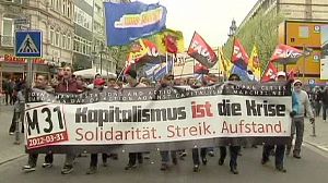 Thousands join anti-capitalism rallies