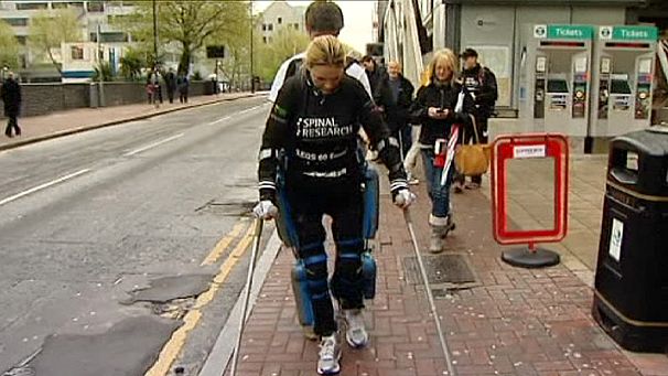 Paralysed woman walks London marathon in bionic suit