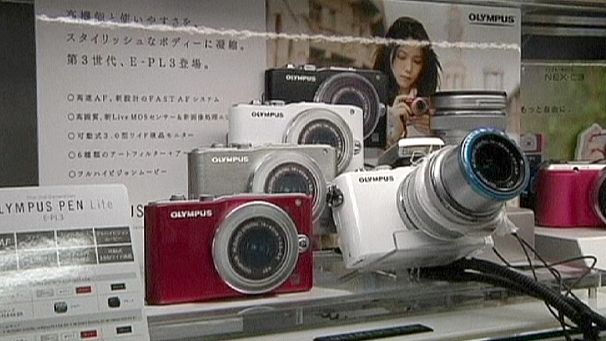 Olympus cuts jobs, looks at tie-ups