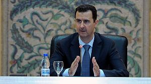 Assad talks of war as fighting reaches Damascus