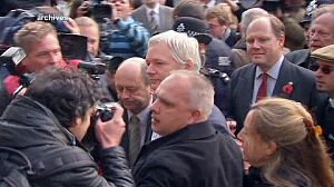 Assange told to turn himself in