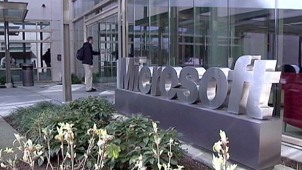 Microsoft posts loss but upbeat on future products
