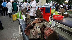 Rescuers comb flattened villages after Iran quakes
