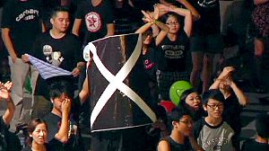 Hong Kong backs down over patriotism lessons ahead of poll