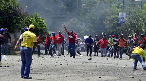 Rival presidential supporters clash in Venezuela