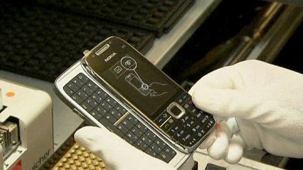 Nokia beats forecasts but losses surge