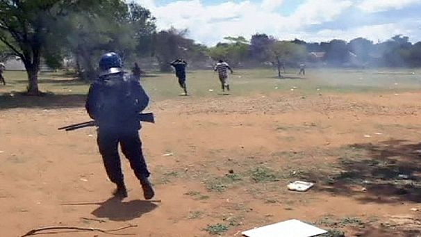Clashes between riot police and South African miners