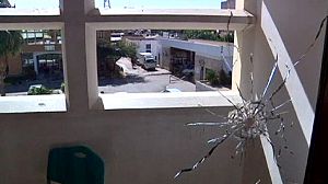 Libya security building hit in rival militia clashes