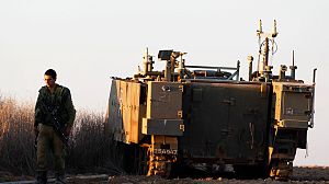 Israeli soldiers mass near Gaza border