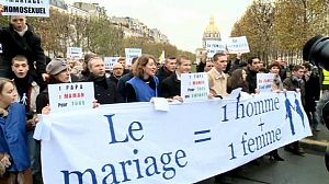 Topless Femen members clash with anti-gay marriage protestors