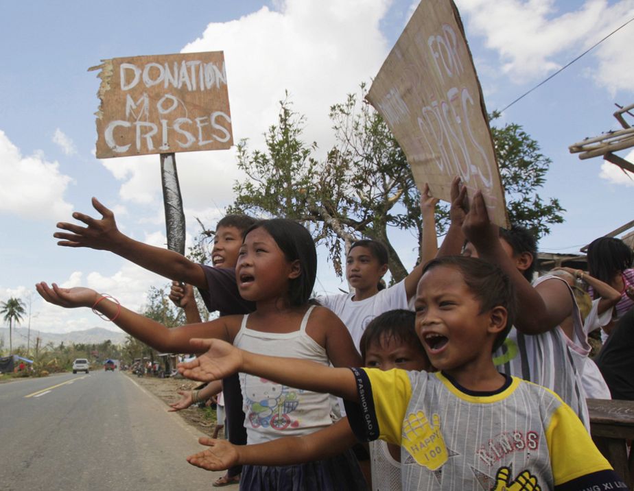 Filipino children appeal for food on roadside Filipino children appeal for food on roadside