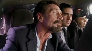 Deported computer tycoon arrives in Miami