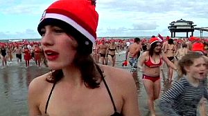 Europeans take a wintry wade on New Year’s Day