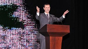 Defiant Assad blames Syria conflict on “outside” forces