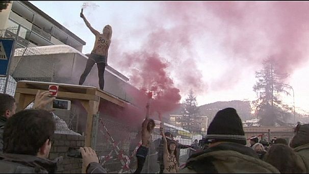 Topless feminists protest in Davos