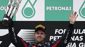 sport: Vettel ignores team orders to win in Malaysia
