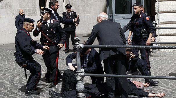 Italy’s new prime minister visits police officer shot outside his office