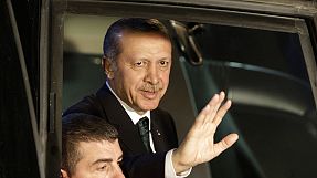 Erdogan returns home with call to end protests