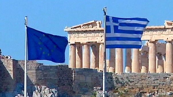 Greek economy shrinks further, EU hits back at IMF over bailout