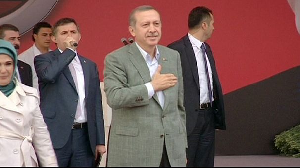 Turkish prime minister defiant at rally