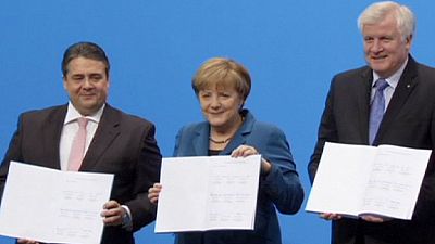 Merkel celebrates coalition deal with Social Democrats Merkel celebrates coalition deal with Social Democrats