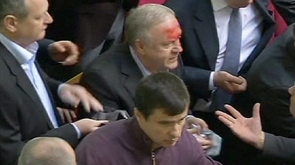 Clashes inside Ukraine parliament as MPs pass strict anti-protest laws