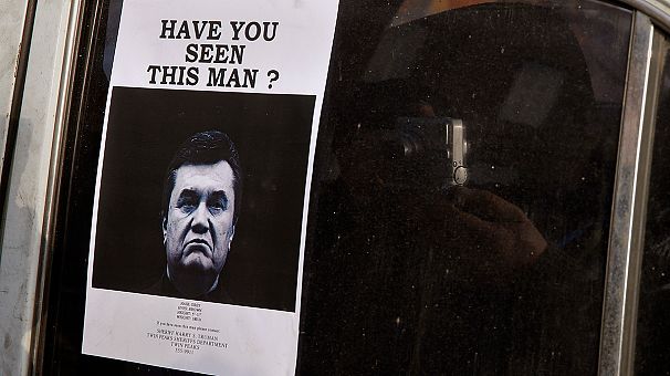 Ukraine police hunt for Yanukovych, charged with mass murder