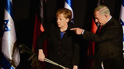 Unfortunate photo sees Angela Merkel given apparent Hitler moustache Unfortunate photo sees Angela Merkel given apparent Hitler moustache