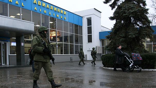 Ukraine denounces ‘armed invasion’ as suspected Russian forces raid Crimea airports