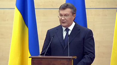 Yanukovych insists on TV he's still in charge of Ukraine Yanukovych insists on TV he's still in charge of Ukraine