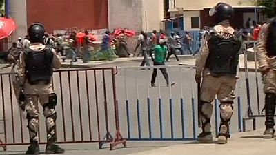 Violence erupts as Haiti police break up protests Violence erupts as Haiti police break up protests
