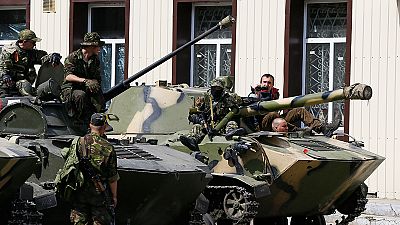 Armoured vehicles flying Russian flags roll into Slovyansk in Ukraine Armoured vehicles flying Russian flags roll into Slovyansk in Ukraine