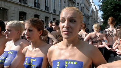 Femen hold topless protest outside National Front campaign launch Femen hold topless protest outside National Front campaign launch