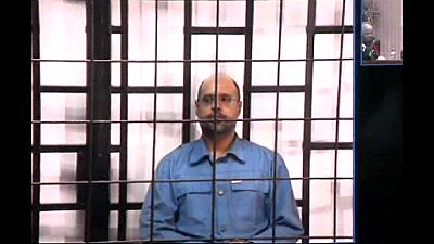 Gaddafi appears before court in Tripoli via videolink on war crime charges Gaddafi appears before court in Tripoli via videolink on war crime charges