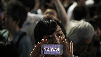 Woman protests against Japan’s new military role Woman protests against Japan’s new military role