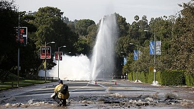 Burst water main floods Sunset Boulevard in Los Angeles Burst water main floods Sunset Boulevard in Los Angeles