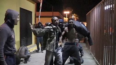 Hundreds of migrants attempt to scale border fence into Spanish enclave of Melilla Hundreds of migrants attempt to scale border fence into Spanish enclave of Melilla