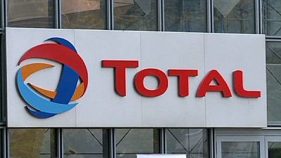 Total cuts investment and employees to counter weaker oil prices Total cuts investment and employees to counter weaker oil prices