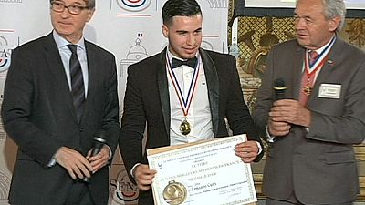 ‘Illegal’ Albanian migrant receives top award at French parliament ‘Illegal’ Albanian migrant receives top award at French parliament